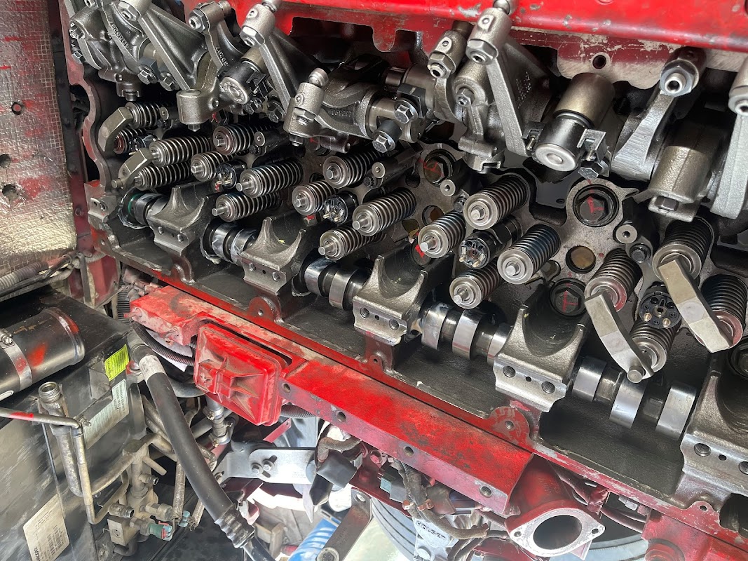 Diesel engine pistons and rocker arms